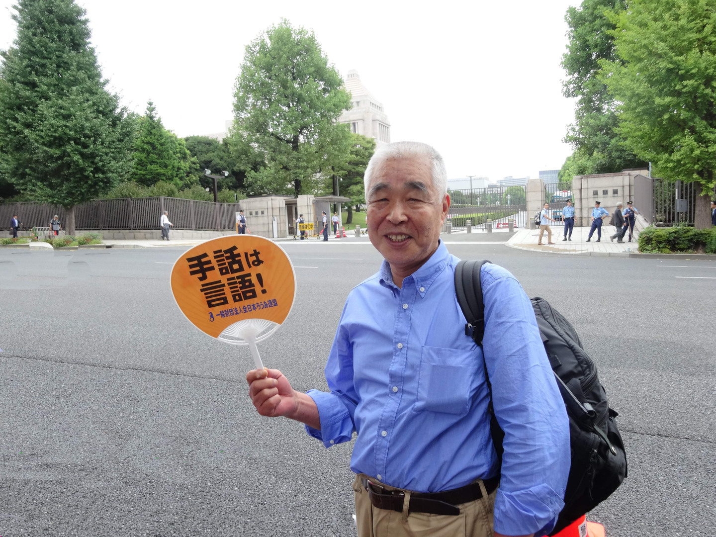 手話言語法制定の実現を求める全国集会に参加した松永朗氏（2015年8月28日　東京都千代田区）